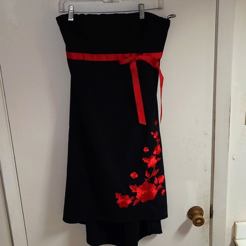 Lipstick Boutique strapless dress with rose design on bottom .